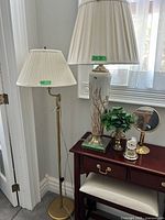 Ceramic table lamp, brass floor lamp with shades beside side table