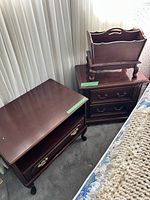 Overall view showing both nightstands and magazine rack