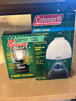 Front of both boxed Coleman lights