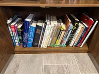 Entire shelf showing 28 books spine-out