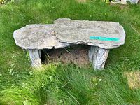 Top view of concrete slab seat showing texture and faux wood legs