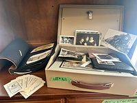 Overall lot with storage case, open album, stack of postal receipts