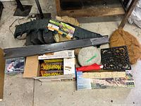 entire assortment on floor showing edging pieces, firestarter boxes, stepping stones, coir mats