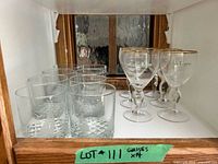Shelf showing 8 rocks glasses and 6 stemmed Irish coffee glasses