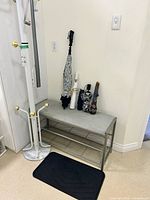Full view coat rack, bench, umbrellas, mat