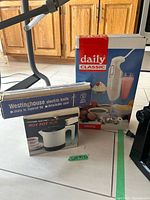 All three boxed items grouped: Daily Classic blender, Westinghouse knife, Eastern Electric hot pot