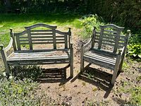 Outdoor wooden bench and chair on garden ground, showing overall set