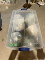 Top view of tote contents showing disco balls and wreath