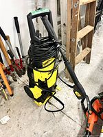 Front view of Kärcher K3.540 with hose and spray wand attached