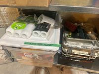 Bin on shelf with painting supplies visible