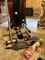 Lot overview: Leg Magic stepper, Smart Arms trainer, rolled Gaiam yoga mat with purple resistance bands