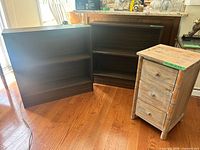 Pair of dark brown bookcases and whitewashed 3-drawer nightstand
