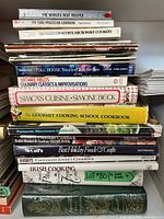 Full stack of cookbooks showing spines and titles