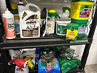 Shelf with multiple fertilizers, repellents, sprayers and bags