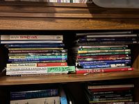Spines of two horizontal stacks showing titles and quantity