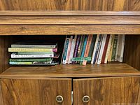 Full shelf view showing two stacks of gardening books