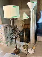 Three floor lamps side by side displaying finishes and shades