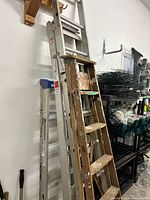 Front view showing all three ladders leaned together