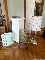All four lamps grouped to show variety and relative sizes