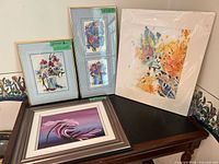 Group shot of all five framed prints on table