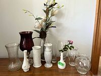 Group shot of all ten vases on tabletop