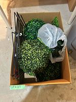 Box with two topiary balls, bag of greenery, folded metal stands