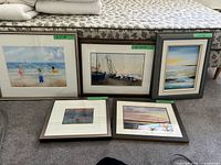 Group shot of five framed prints showing subjects and frames