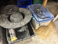 overview of totes, fountain float, pump on blue-lid tote