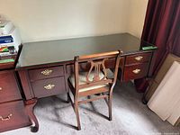 Front view of desk with chair and glass top