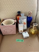 All items arranged in box, showing two lamps, three refills, crock and wick box