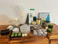 Overall lot showing variety of candles, holders, saucers and stand