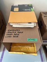 Top view of box showing stacks of envelopes and paper