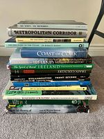 Full stack of 14 books showing spines and titles