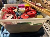 Overview of tote with ribbon spools, mesh rolls and bowmaker tool