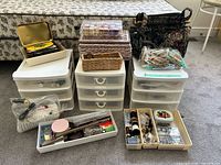 Full lot showing storage towers, wicker baskets, sewing accessories, trays of notions, Singer accessory bag