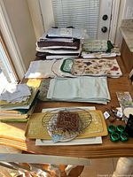 Overview of linens, trays, wire baskets, napkin rings, trivets