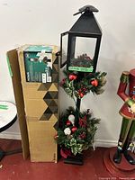 Full lamp post beside original box, overall view and packaging