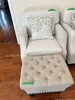 Armchair with pillow and ottoman front view