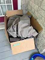 Box containing multiple folded outdoor covers