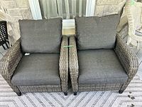 front view of both gray wicker chairs with cushions
