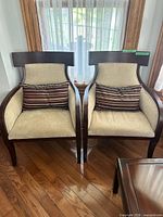 Front view of both accent chairs with pillows