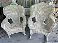 front view of both wicker rocking chairs on porch