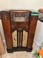 Full front view of RCA Victor wood console tube radio
