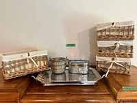 Lot overview showing four baskets, metal tray, wire bucket, oval container