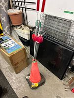 Traffic cone holding several reflective stakes