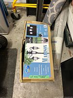 Box showing SunRay Madison solar lamp post planter graphics and product details