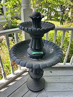 Full front view of two-tier fountain on porch