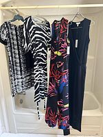 Four garments on hangers showing overall styles and lengths