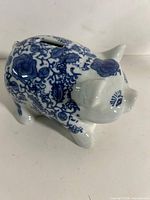 Left side view showing floral pattern and coin slot