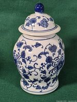 Full view of ginger jar with lid showing overall form and decoration